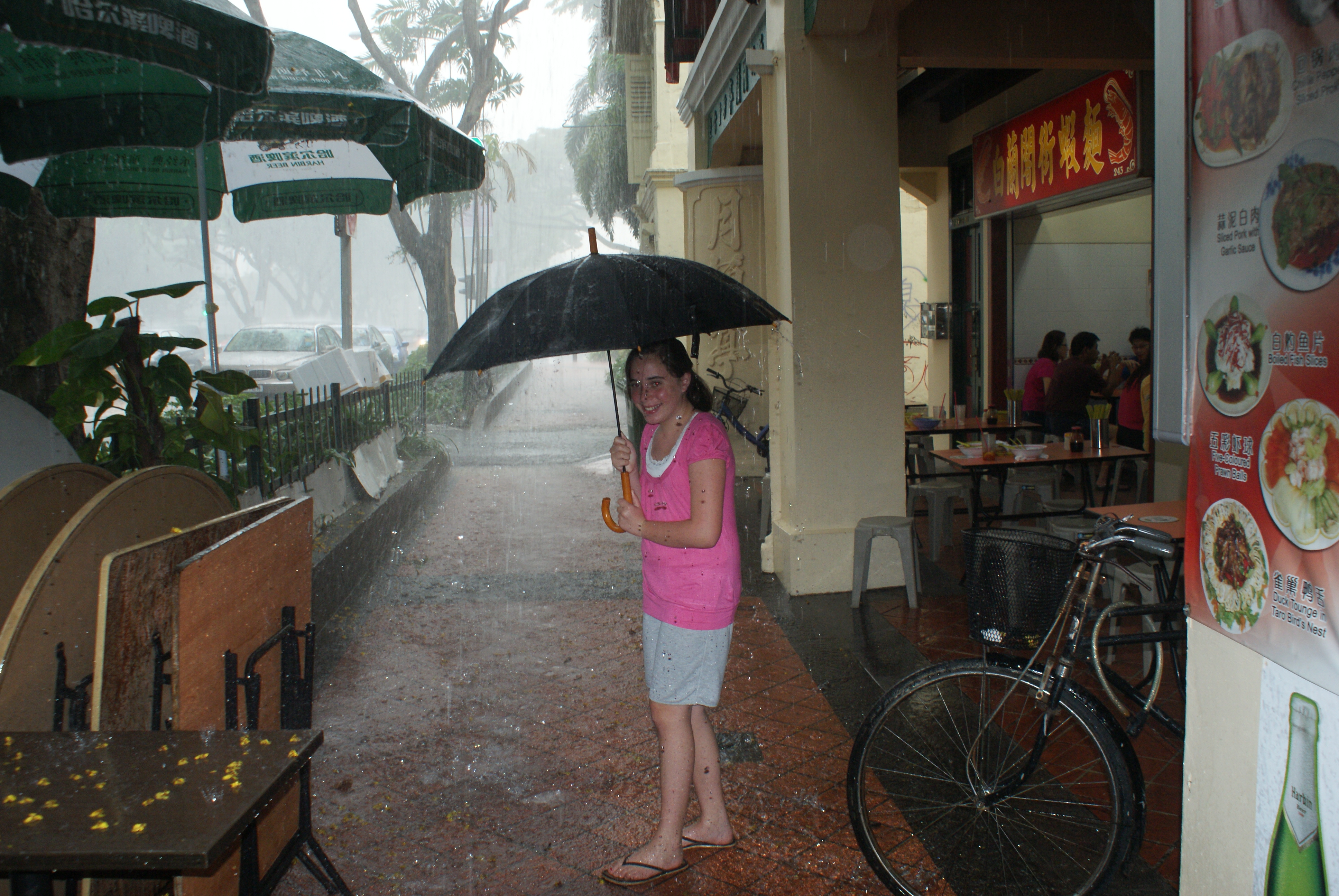 Singapore deluge. The umbrella is symbolic.