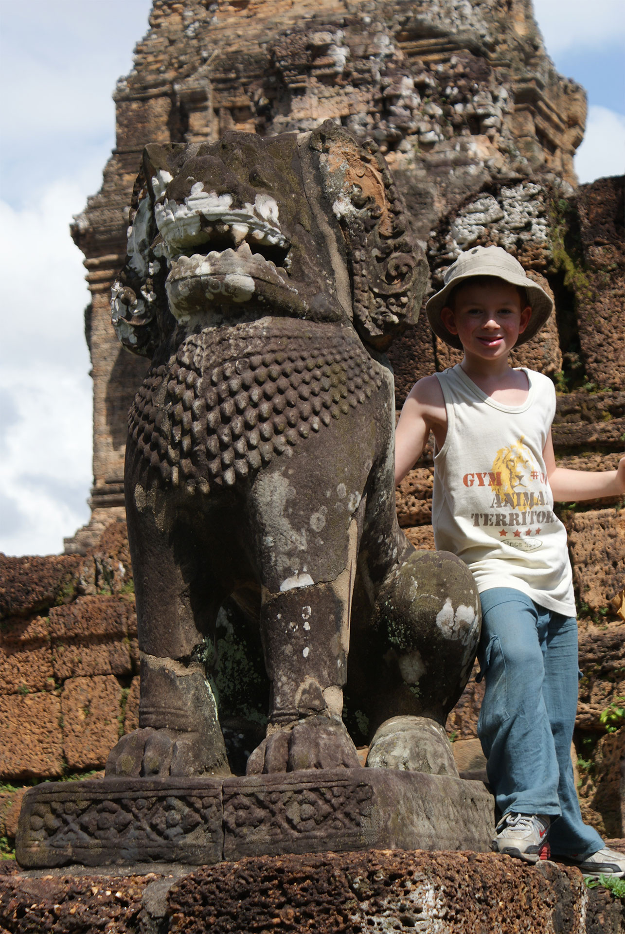 child in cambodia at statue