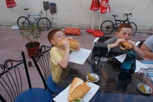 Eitan and Daniel attacking their kofte sandwiches
