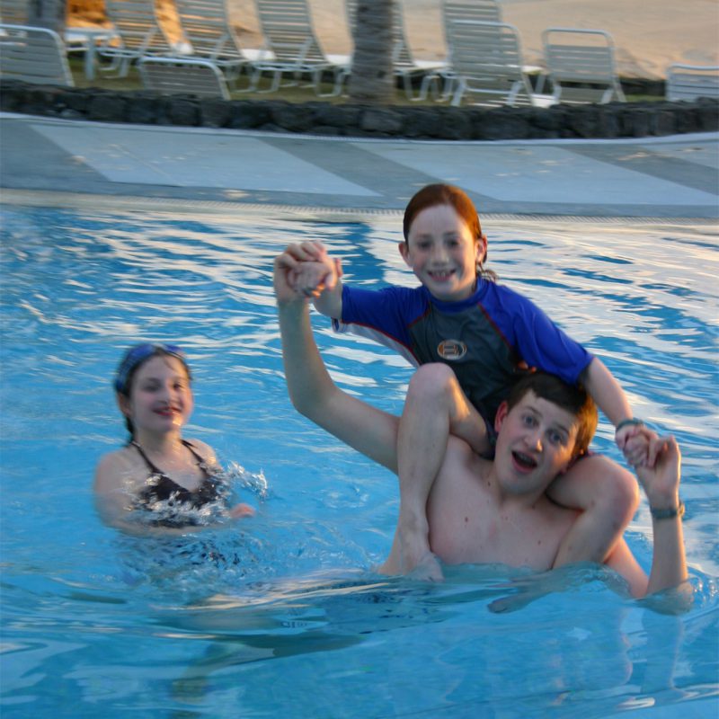 family in pool in south africa