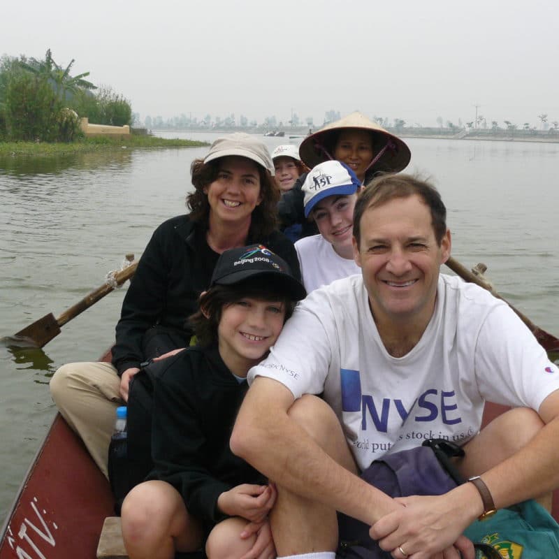 family in vietnam boat pagoda