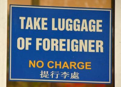 take luggage of foreigner