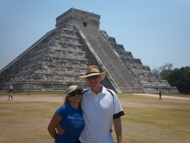 couple in front of mayan temple in mexico